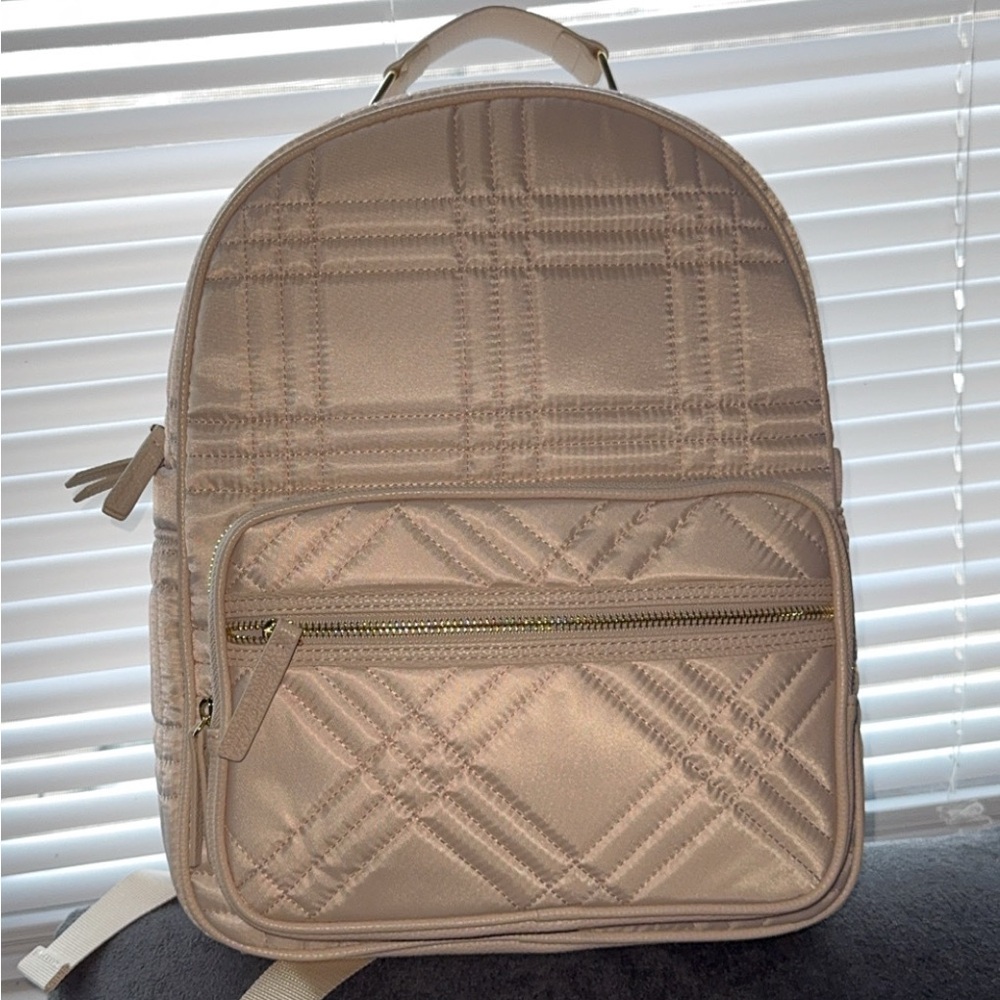 Cream colored Tommy Bahama backpack